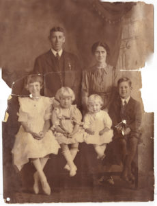 Dickson Family before digital restoration, photo was cracked in half