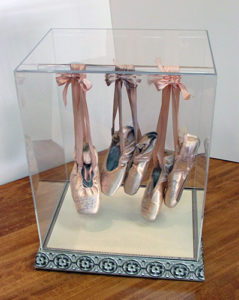 A beautiful custom display case for ballet slippers, made right here at The Frame & I, is a sweet display for a little girls' room!